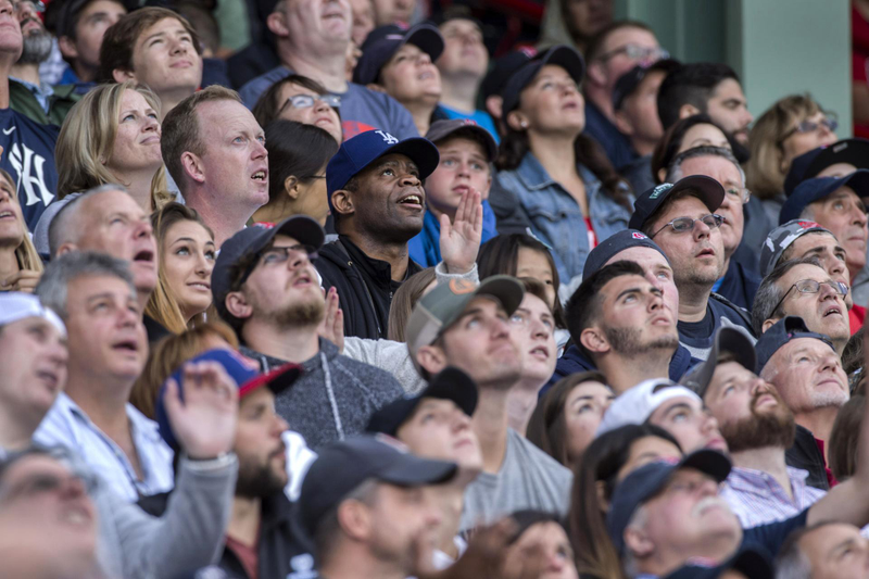 Fans watch as the Boston Red Sox play the New York Yankees at Fenway Park in Boston in July. (Keith Bedford/Boston Globe)